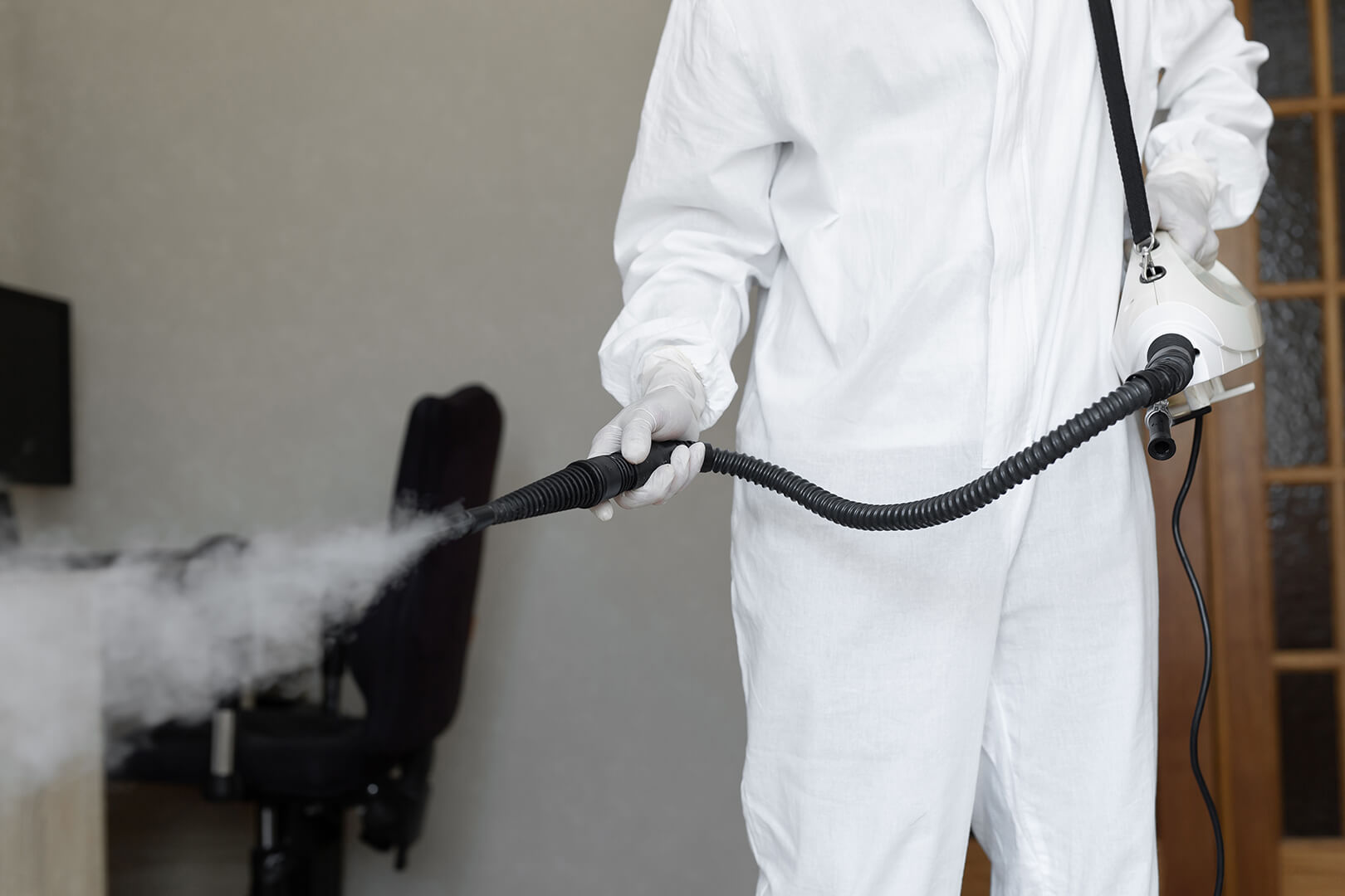 Person dry-fogging a home to remove mold